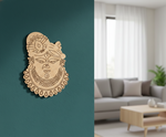 Decorative  MDF DIY  wall art of a face with intricate designs on a teal wall, with a living room in the background.