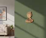 MDF DIY Buddha figurine on a green wall with a living room in the background