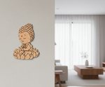 MDF DIY Buddha wall decoration on a light gray wall with a modern living room in the background.