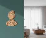 MDF DIY Buddha wall decor on a teal wall with a living room in the background
