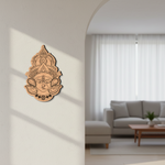 Decorative MDF DIY wall art of a face design on a white wall with a blurred living room in the background.