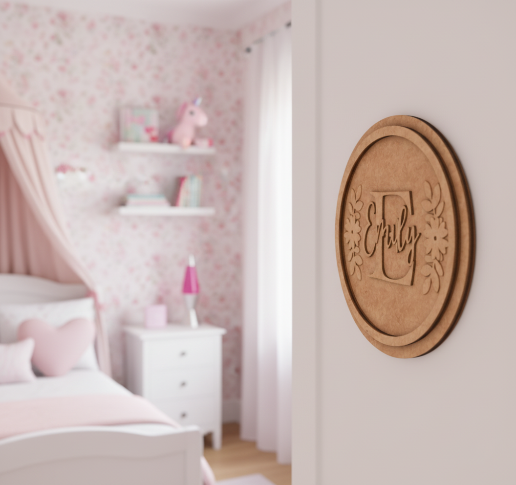 Customized round MDF name plate with floral design and name Emily in orange background.