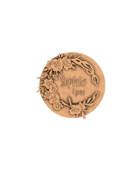 Painted MDF round floral name plate with custom name “Sophie Lynn.” unpainted