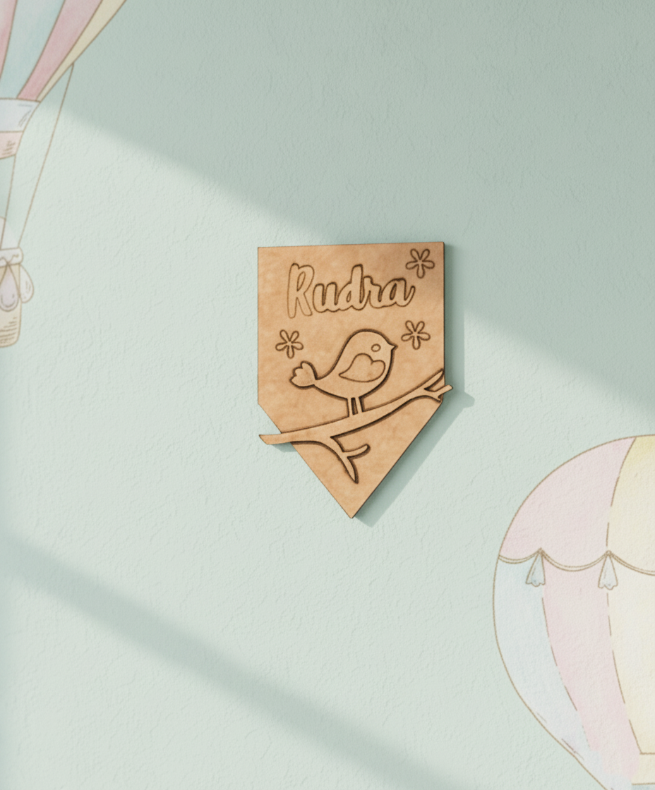 DIY MDF name plate with engraved bird on branch and floral design, customizable with name Rudra unpainted.