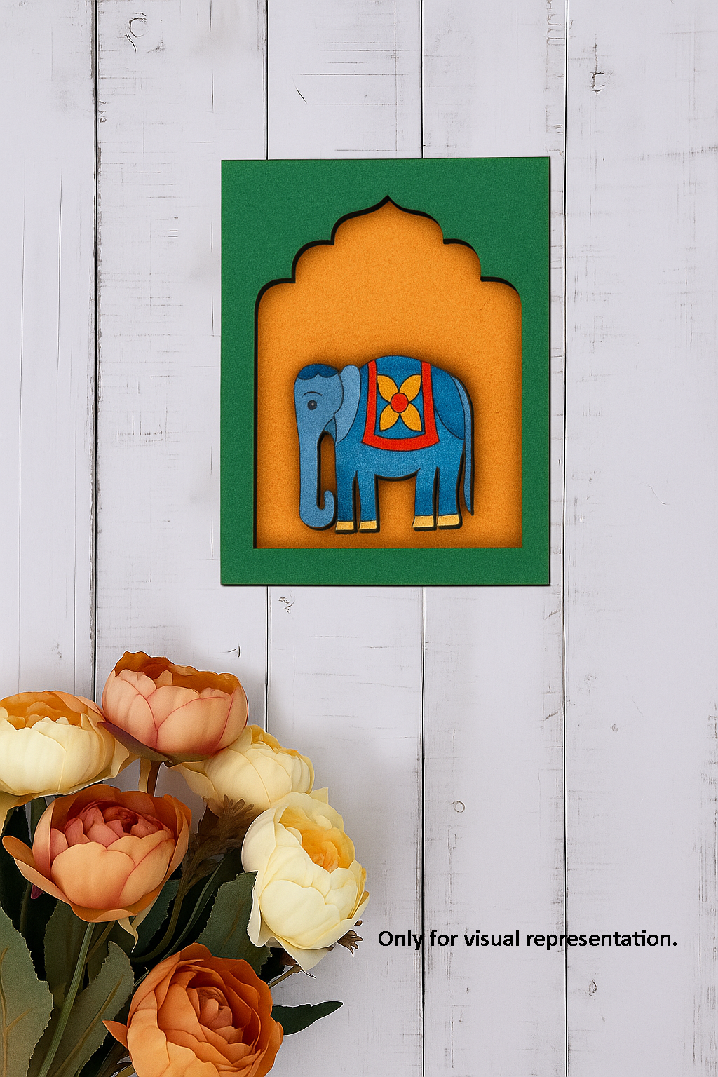 Painted MDF elephant wall hanging with colorful ethnic design on green and orange background.