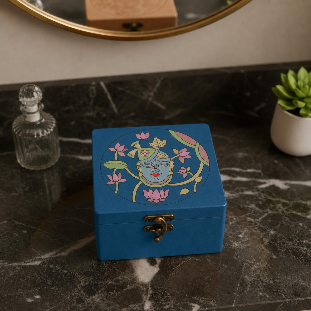 Blue MDF lock box with shreenathji design kept on a marble surface