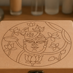 DIY MDF Lock box with intricate line art of a face and lotus flowers on a wooden surface.