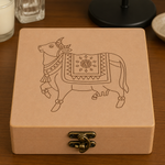 DIY MDF Lock box with an engraved pichwai cow design on a wooden surface