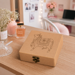 MDF Lock box with pichwai cow design on a table with decorative items