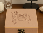 Wooden sacred cow engraved lock box on dresser – front angle