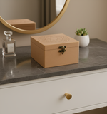 MDF Beige jewelry box on a dresser with a mirror and small plant in the background
