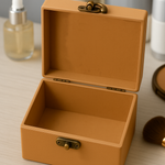 MDF jewelry box with a gold clasp on a light surface.