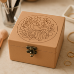 Brown jewelry box with bird and floral design on a beige surface