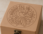 Close-up of floral bird engraved wooden storage lock box