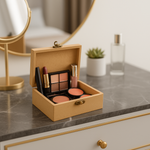 Open beige makeup box with cosmetic products on a marble countertop.
