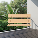 MDF swing hanging on a porch with greenery in the background