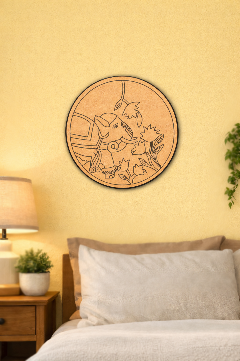 Decorative MDF DIY wall art with a circular design of a character and a elephant on a yellow wall above a bed.