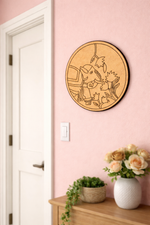 MDF DIY wall art of a elephant on a pink wall above a wooden cabinet with plants and flowers.