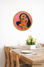 Dining room with a colorful MDF DIY  wall art of a woman's face on a white wall.