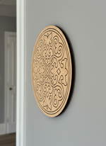 Decorative MDF DIY mandala wall art with intricate patterns on a gray wall.