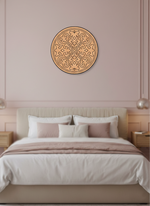 Decorative MDF DIY mandala wall art above a bed in a bedroom with pink walls.