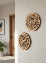 Two MDF DIY wall art pieces with geometric patterns on a white wall.