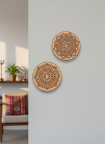 MDF DIY wall decor pieces with intricate patterns on a gray wall.