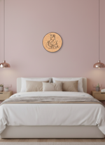 Bedroom with pink walls, a bed, and a decorative MDF DIY wall piece.