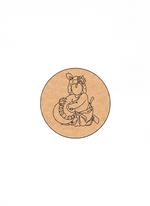 Circular MDF DIY wall art with a line drawing of a krishna holding a pot on a white background
