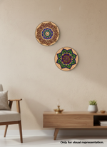Two decorative circular MDF DIY wall art pieces on a beige wall with a wooden cabinet and chair in the foreground.