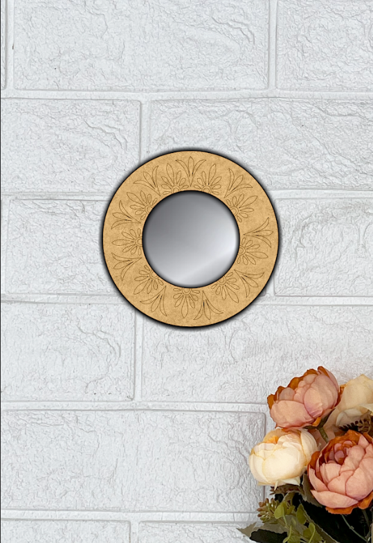 Round MDF wall mirror with floral engraved frame on white textured wall