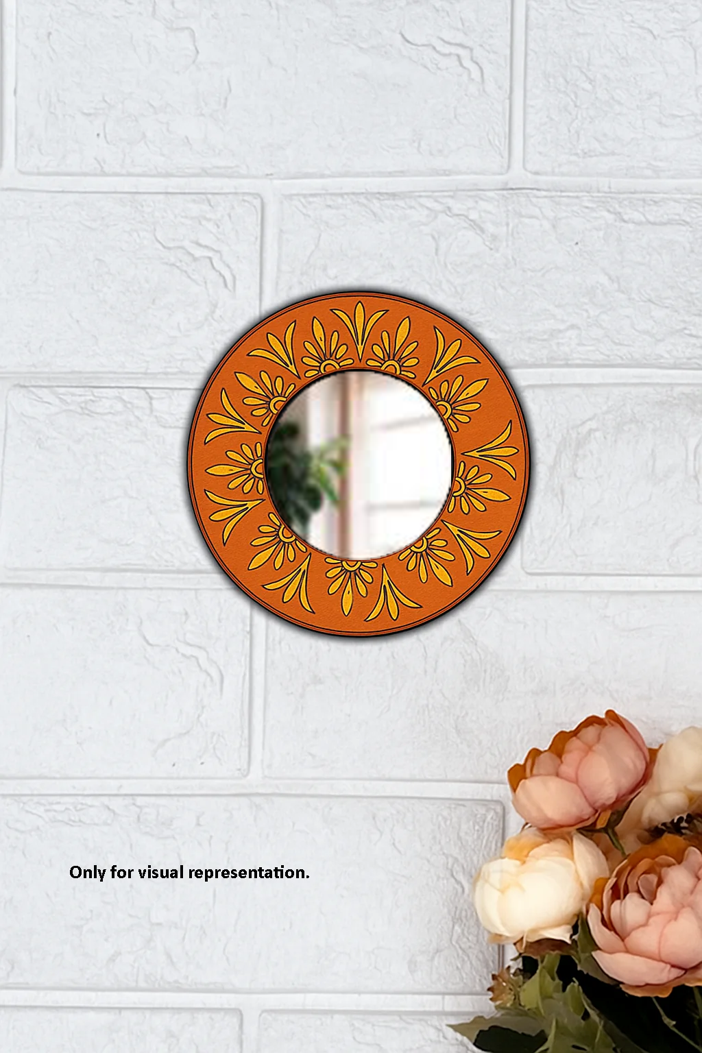 Round decorative DIY wall mirror with floral patterns on an off-white textured wall.