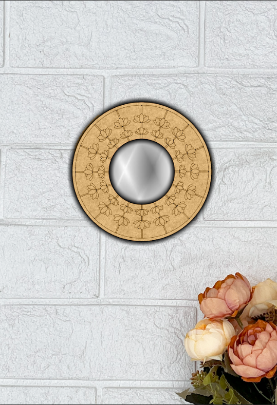 Round MDF wall mirror with floral engraved frame on white textured wall