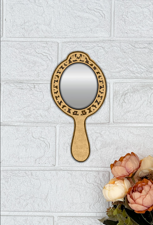 MDF handheld vanity mirror with engraved frame on white wall