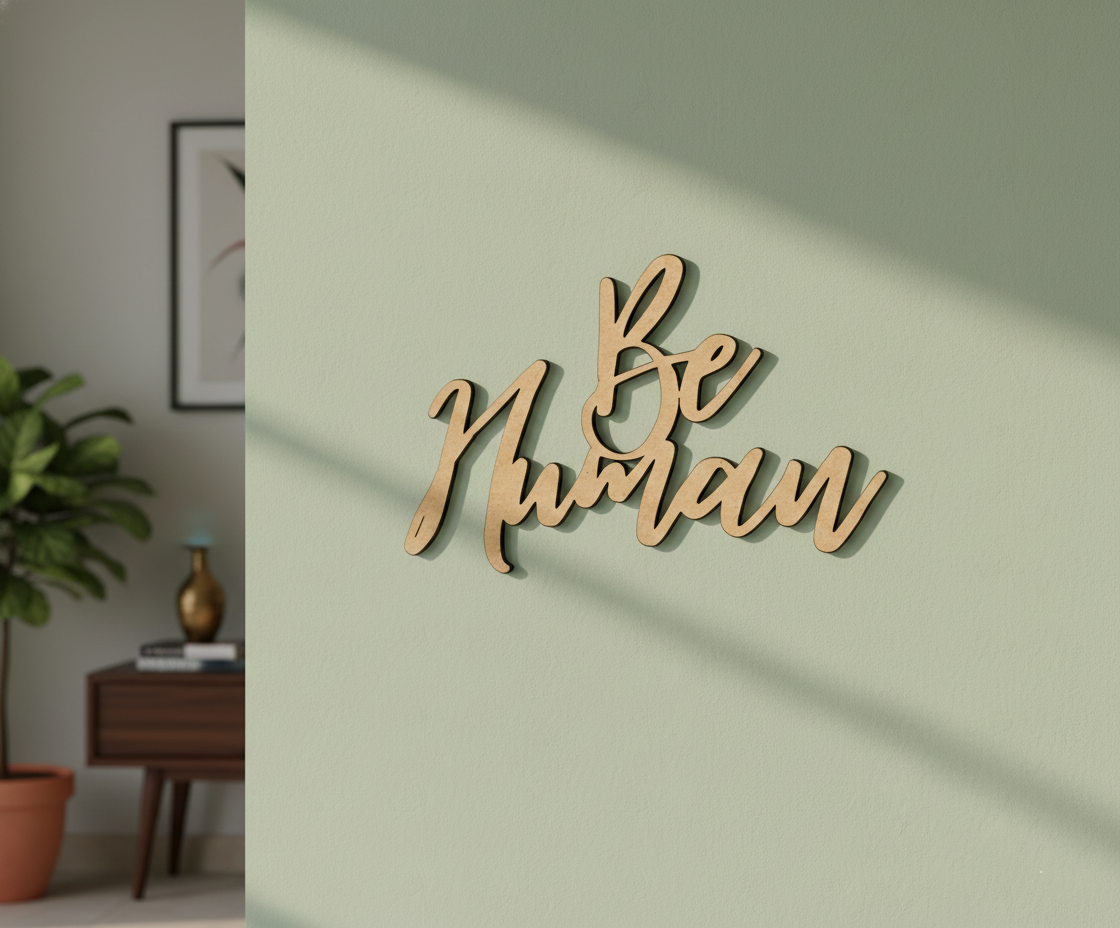 Unpainted MDF Be Human quote DIY cutout for wall decor and craft projects, mounted on wall
