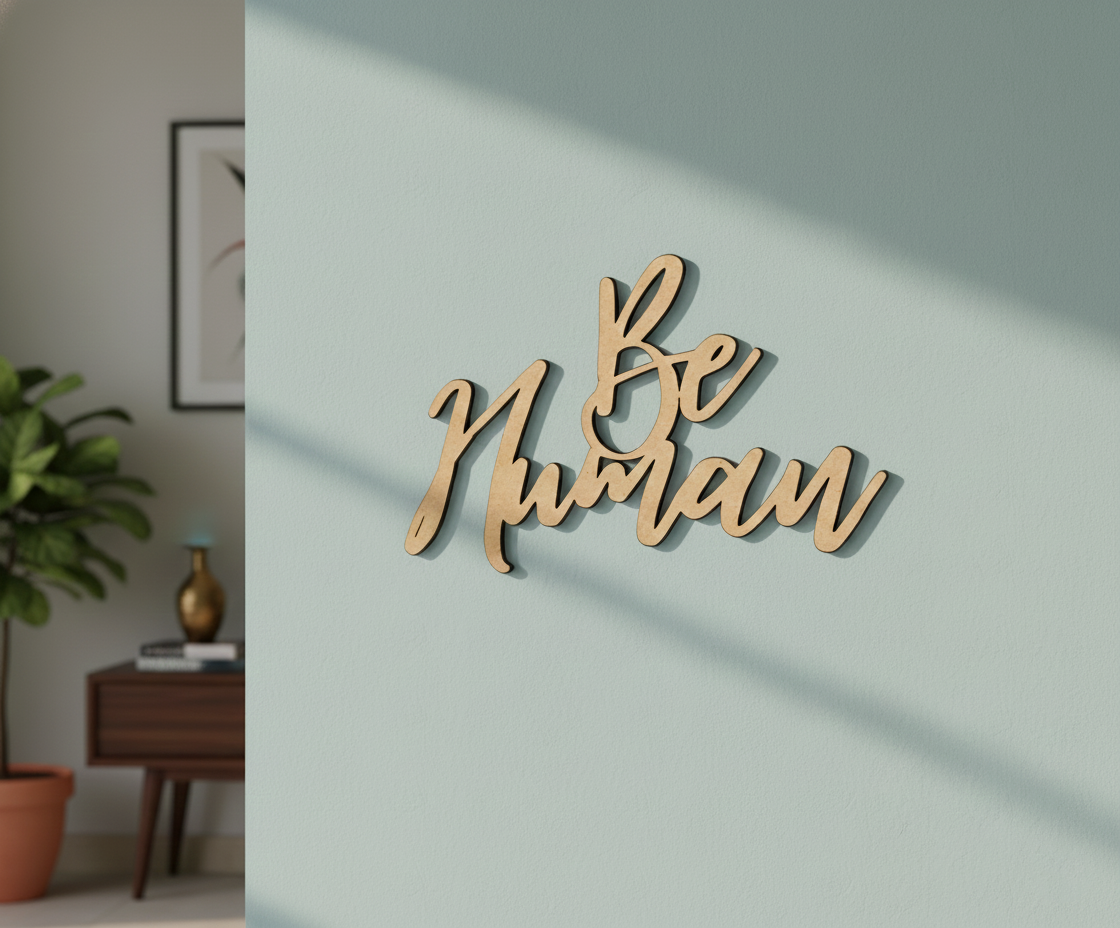 Unpainted MDF Be Human quote DIY cutout for wall decor and craft projects, mounted on wall