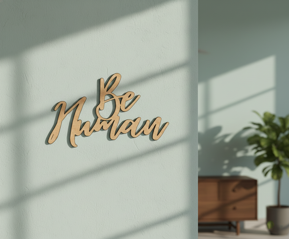 Unpainted MDF Be Human quote DIY cutout for wall decor and craft projects, mounted on wall