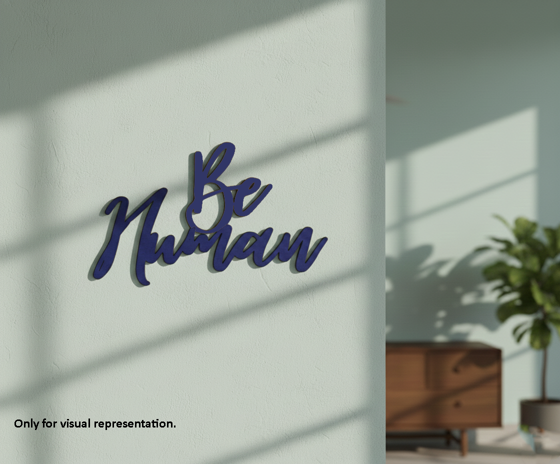 Painted MDF Be Human quote DIY cutout for wall decor and craft projects, mounted on wall