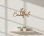 Unpainted MDF Be Careful quote DIY cutout for wall decor and craft projects, mounted on wall