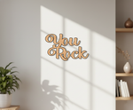 Unpainted MDF You Rock quote laser cut DIY wall decor craft cutout, mounted on wall