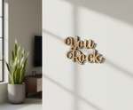 Unpainted MDF You Rock quote laser cut DIY wall decor craft cutout, mounted on wall