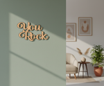Unpainted MDF You Rock quote laser cut DIY wall decor craft cutout, mounted on wall