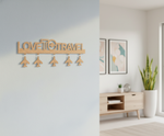 Unpainted MDF Love To Travel quote laser cut DIY wall decor key holder with airplane charms, mounted on wall