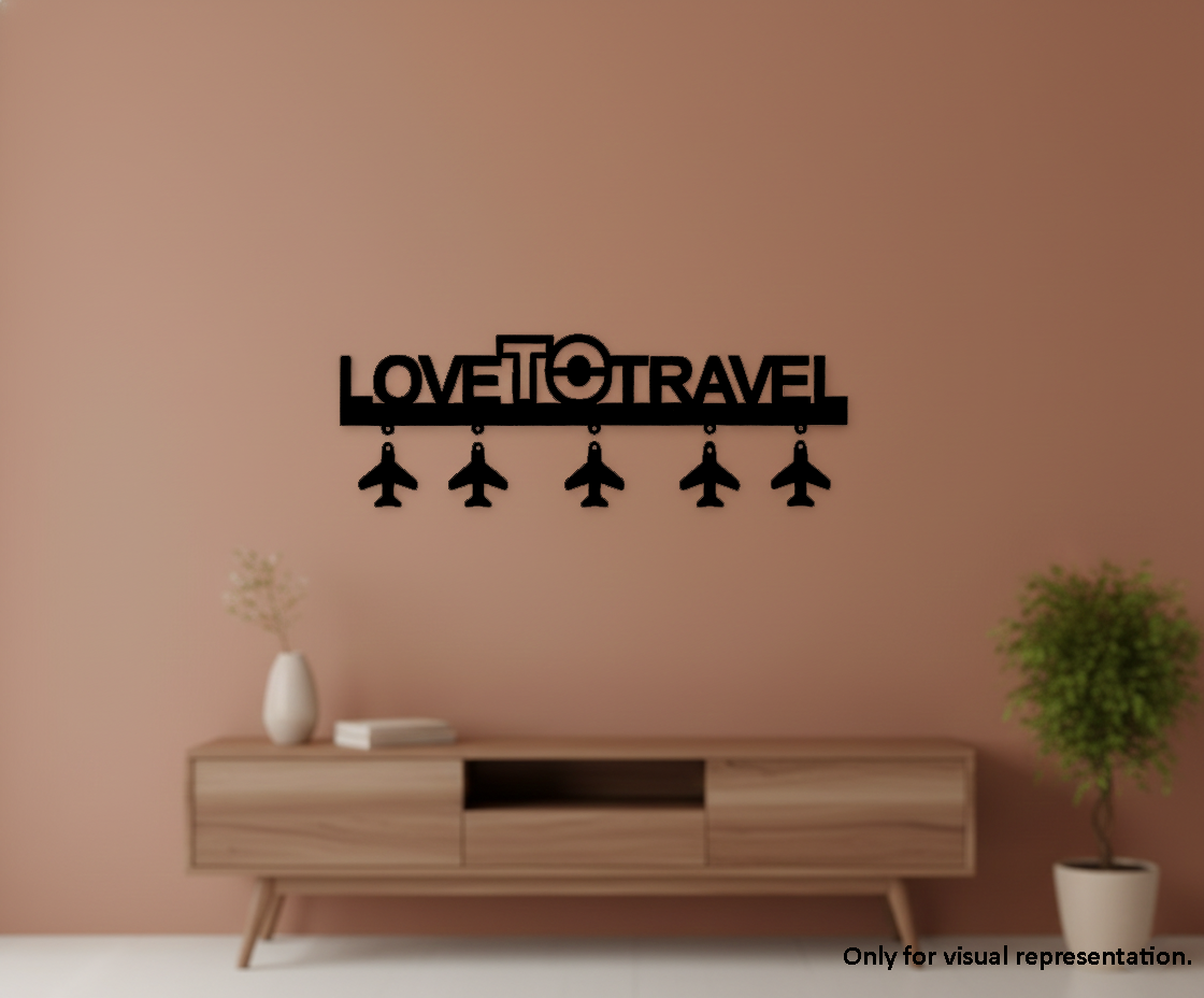 Painted MDF Love To Travel quote laser cut DIY wall decor key holder with airplane charms, mounted on wall