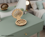  shell-shaped MDF DIY Jewellery Box on a green table with a blurred living room background