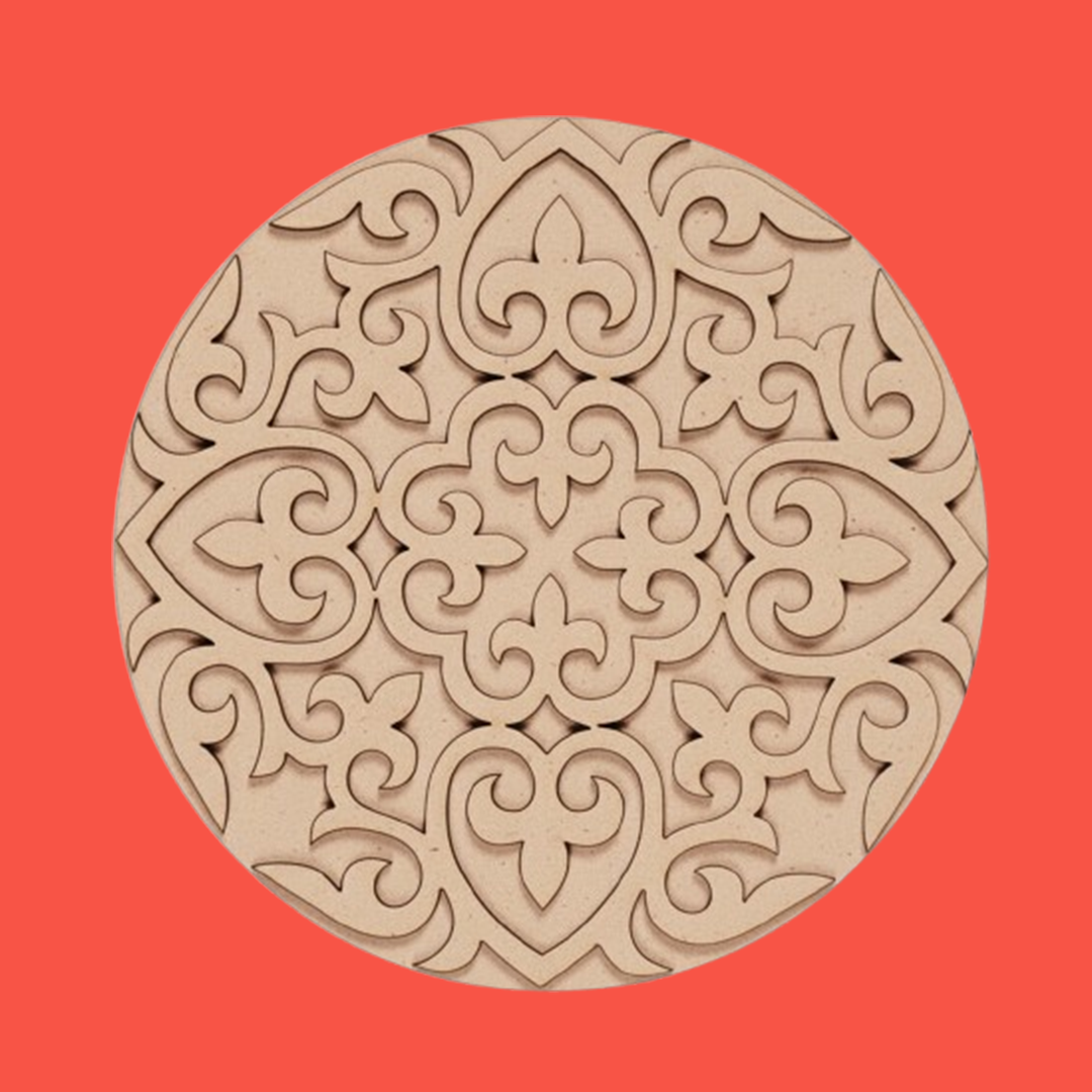 Unpainted round layered laser-cut MDF mandala base with intricate ornamental floral pattern on red background 