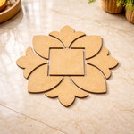 Unpainted MDF square floral rangoli cutout base with central square and surrounding petal shapes, placed on a marble floor 