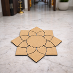 Unpainted MDF lotus petal rangoli cutout base with scalloped round centre and surrounding layered petal shapes placed on a marble floor