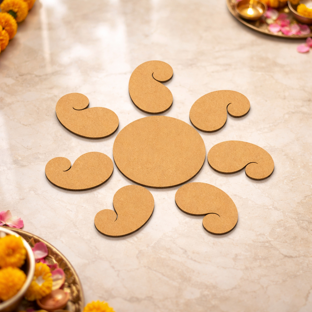 Unpainted MDF paisley rangoli cutout set with central round base and surrounding curved paisley shapes placed on marble floor