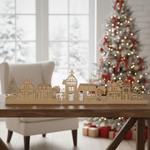 DIY Christmas village MDF décor with LED lights displayed on table in holiday living room setting 